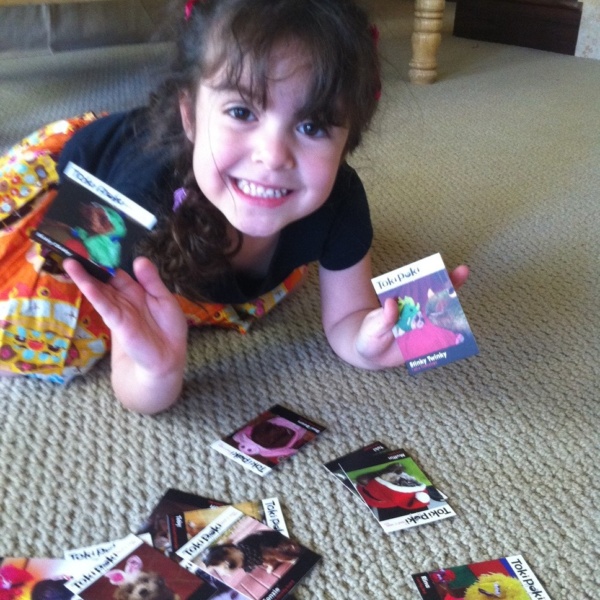 Sabrina looking at her Toki Poki cards